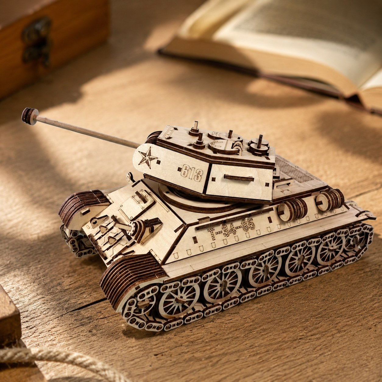 Close-up of laser-cut wooden tracks and engravings on the tank