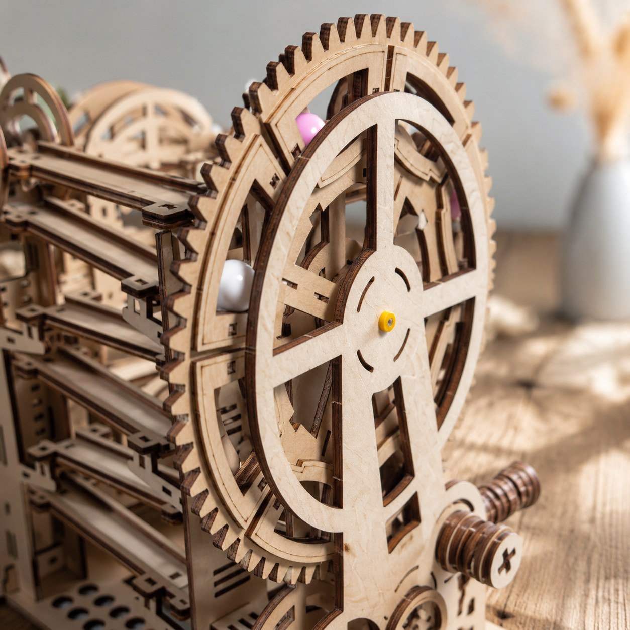Close-up of laser-cut wooden gears and joints