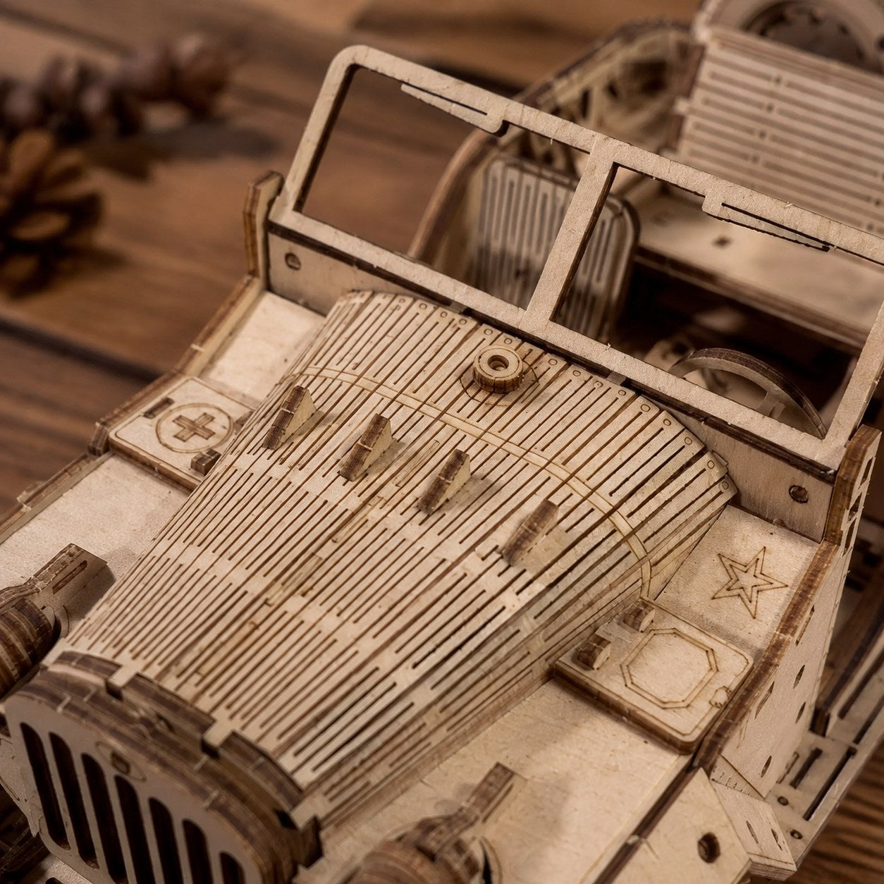 Macro close-up of the laser-cut wood details on the off-road vehicle puzzle.