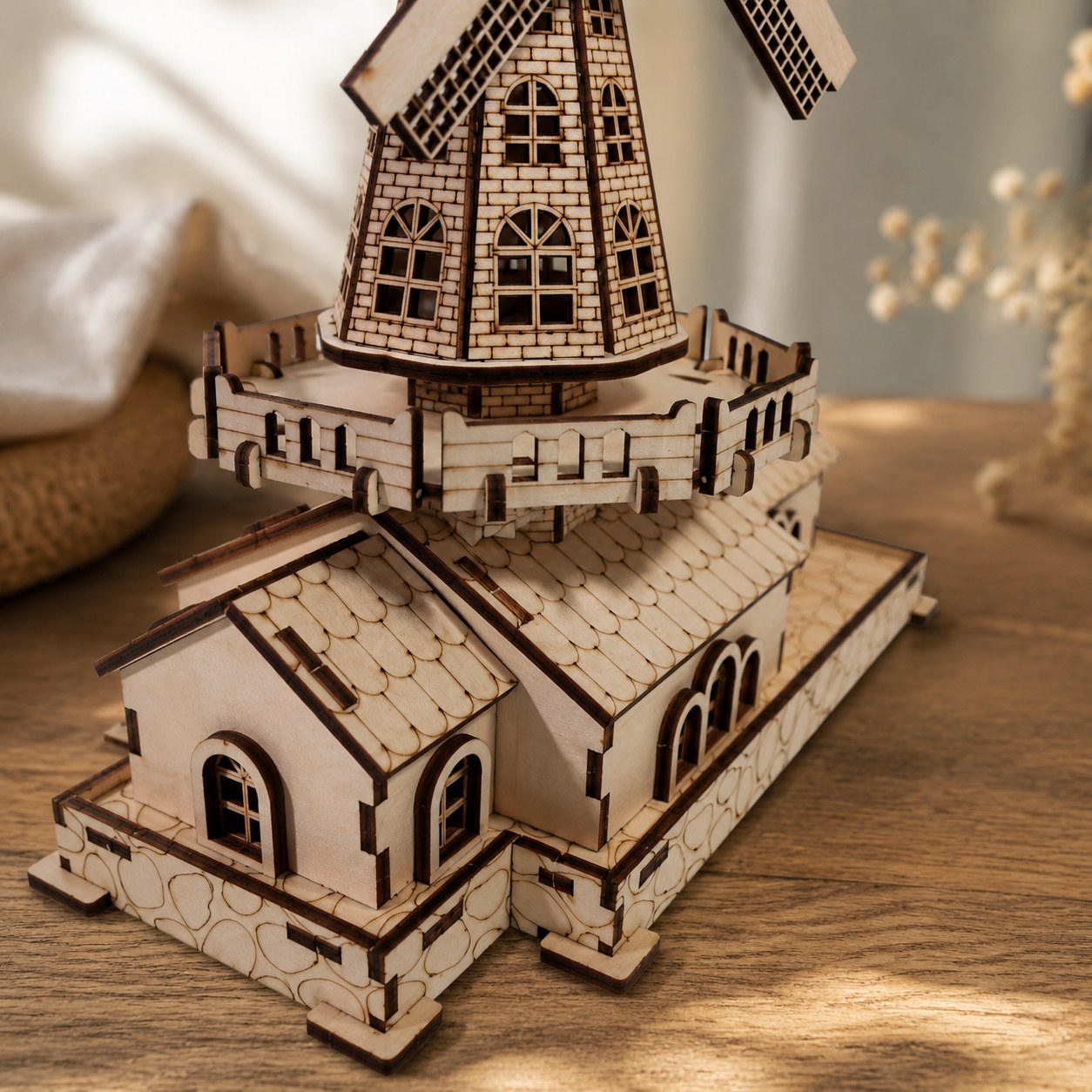 Macro close-up of laser-cut wood details on the windmill tower