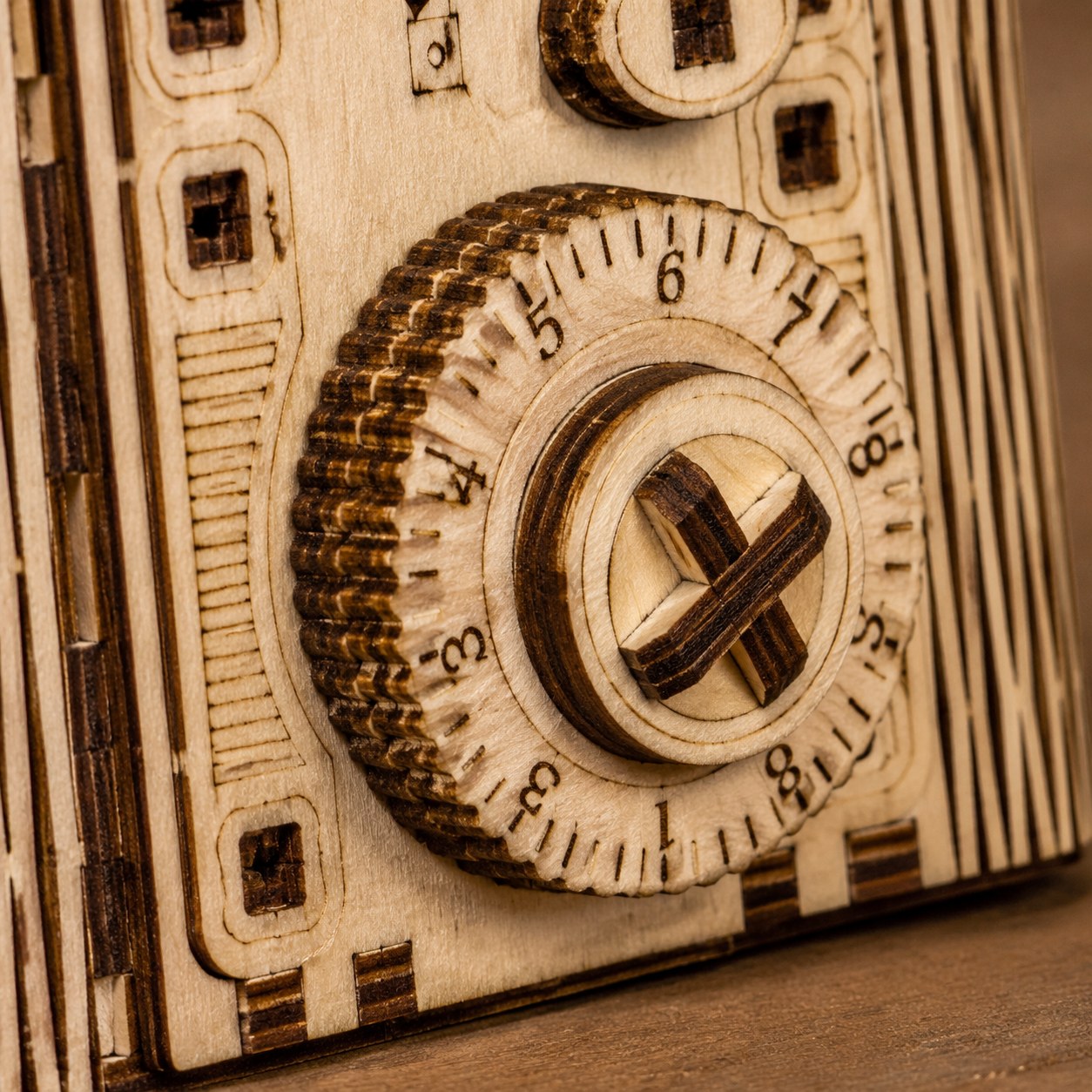 Macro close-up of laser-cut wooden gears and combination dial details