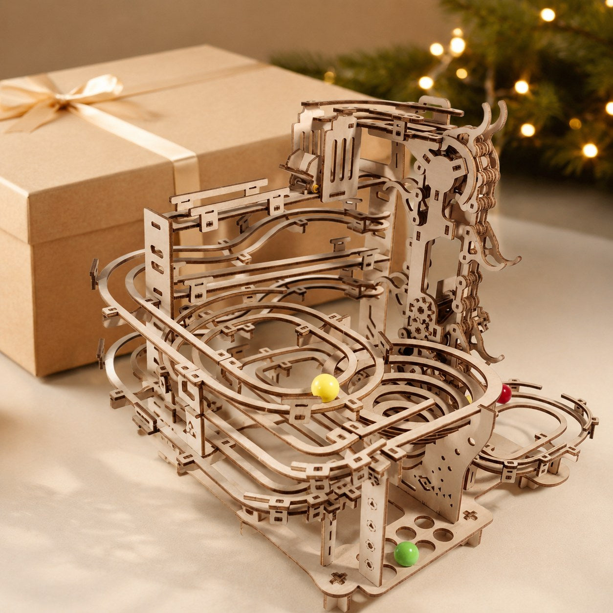 Mechanical marble run 3D wooden puzzle presented next to a kraft gift box.