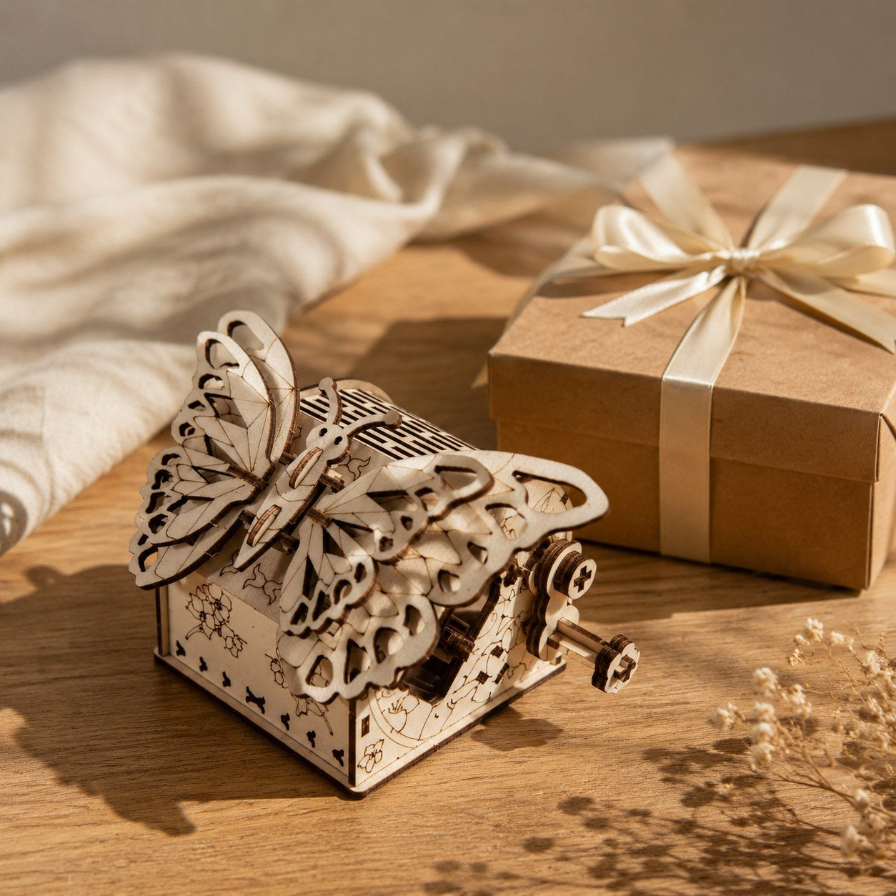 Wooden butterfly model kit next to a gift box.