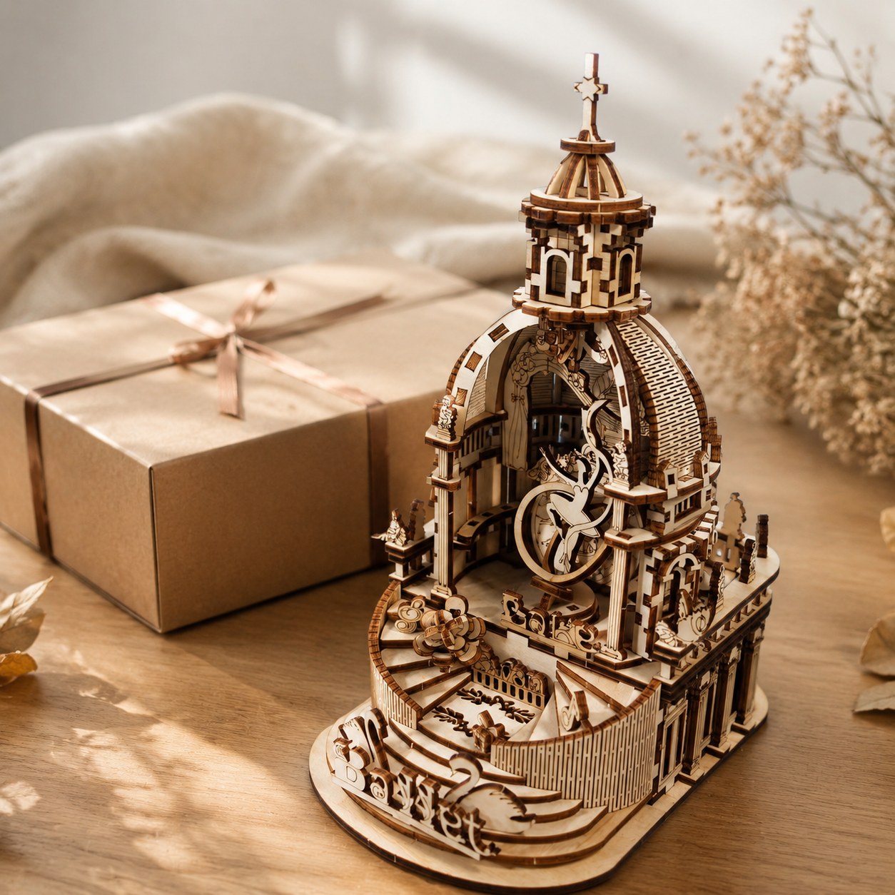 Finished Swan Lake 3D wooden puzzle displayed next to a gift box