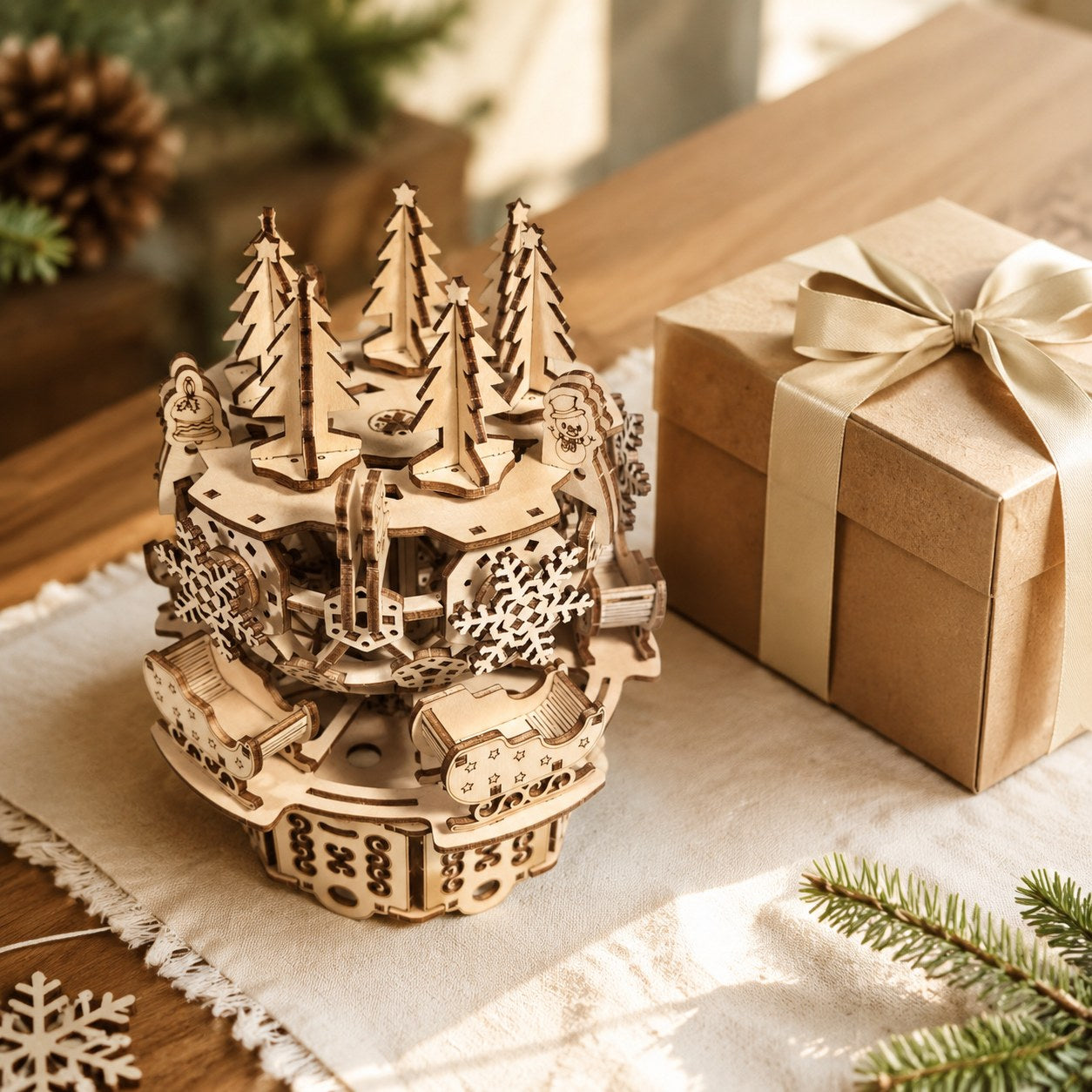 Wooden Christmas carousel puzzle next to a gift box