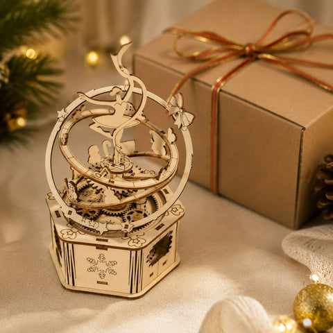 Jigden Orbital Ballerina wooden music box displayed next to a gift box